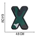 Dettaglio della toppa ricamata mimetica lettera X con dimensioni di 6,4 cm x 4,6 cm. - Lettera X (A004)