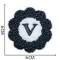 Black and white flower shaped chenille embroidery patch with letter V detail, 6cm size - Letter V