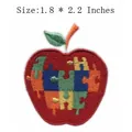 Apple shaped embroidered patch with colorful puzzle piece design, measuring 1.8 x 2.2 inches. - Puzzle Apple (77455) / 4.6x5.6cm