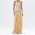 Close-up detail of champagne 3D floral strapless top paired with pleated maxi skirt - S / Top And Bottom / Yellow