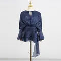 Detailed view of a shimmering blue mesh dress featuring pleated puff sleeves and ruffles - S / Dresses / Navy Blue