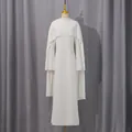Detail of white maxi dress featuring a built-in shawl with elegant pearl beaded edges - S / Tops / White
