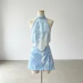 Two-piece resort set with blue abstract print halter top and matching mini skirt on mannequin. - S / Top And Bottom / Blue