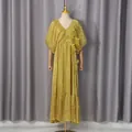Detailed view of elegant yellow V-neck maxi dress featuring 3D floral embellishments - M / Dresses / Yellow-Green