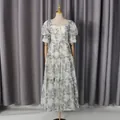 Vintage white floral maxi dress with puff sleeves and heart-shaped neckline on a mannequin. - S / Dresses / Purple
