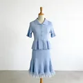 Detailed view of light blue knitted two-piece set with polo collar and lace trim. - S / Top And Bottom / Blue