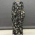 Elegant black and white floral print maxi dress featuring V-neck and batwing sleeves - One Size / Dresses / Black Floral