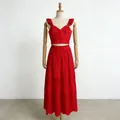 Red V-neck ruffle crop top and high-waist embroidered skirt set displayed on a wooden mannequin - S / Top And Bottom / Red