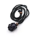 Detailed view of a handmade black braided rope necklace with a natural purple crystal - Purple Crystal
