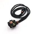 Handmade black woven cord necklace featuring a natural green and red raw stone pendant - Unakite