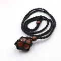 Handmade black woven net necklace featuring a natural reddish-brown raw stone pendant - Red Agate