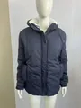 Detail of navy blue women's hooded jacket with warm white sherpa lining and zip-up front. - S / Tops / Blue