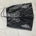 Detailed view of men's black Oktoberfest shorts with traditional white embroidery and belt - 3XL / Bottoms / Black