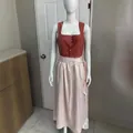Brick red and light pink German Dirndl dress shown on a female mannequin - XS / Set / Brick Red