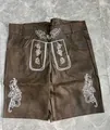 Detail view of traditional German Oktoberfest brown Lederhosen with white embroidery. - 3XL / Bottoms / Brown