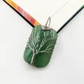 Detail of handmade wire wrapped green gemstone pendant with Tree of Life design. - Green Aventurine