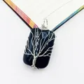 Detailed view of a handmade wire-wrapped tree of life pendant with a black gemstone base. - Black Agate Pendant / 1 Piece / Black Agate