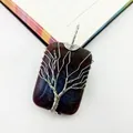 Detailed macro view of handmade wire wrapped tree of life agate stone pendant jewelry - India Agate