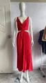 Detailed view of an elegant red sleeveless V-neck pleated maxi dress with cutout waist - S / Dresses / Red