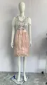 Detailed view of pink and silver German Oktoberfest dirndl costume on a full white mannequin - XS / Dresses / Pink
