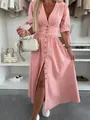 Fashionable pink V-neck button-down denim maxi dress shown in a lifestyle closet setting - S / Dresses / Pink