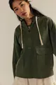 Detail shot of a dark green washed denim hoodie with half-zip and oversized pockets. - S / Tops / Army Green