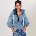 Stylish oversized light blue wash denim hoodie with half-zip and large front pockets - S / Tops / Blue