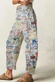 Détail du motif graffiti multicolore sur un jean denim blanc cassé à coupe large. - S / Graffiti