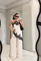 Elegante set top all'americana in pizzo e pantaloni a gamba larga con orlo irregolare - Taglia S / Top E Pantaloni / Bianco latte
