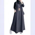 Full-length view of a retro loose denim pinafore dress with large side pockets - S / Dresses / Dark Blue