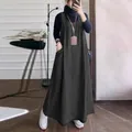 Detail view of charcoal grey maxi denim pinafore dress with functional side pockets - S / Dresses / Black