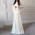 Elegant white long-sleeved floor-length dress with round neck and flared bell sleeves - XS / Dresses / White