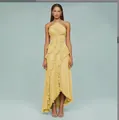 Fashionable yellow pleated halter neck dress featuring a sexy backless design and ruffle hem - Yellow