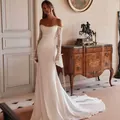 Elegant off-the-shoulder mermaid wedding dress with delicate lace sleeves and a train. - US2 / Dresses / Ivory
