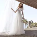 Elegant V-neck long sleeve lace wedding dress with a slim fit and small train details - US2 / Dresses / Pure White