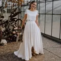 Elegant bohemian white lace and satin two-piece wedding dress for bridal travel photography - 26W / Top And Bottom / Ivory