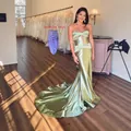 Elegant sage green satin strapless mermaid evening gown with a small train and lace-up back. - US2 / Dresses / Light Green