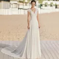 Elegant white V-neck lace wedding dress with small train and slim fit A-line silhouette. - 16W / Dresses / Off White