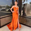 Elegant strapless orange satin mermaid evening gown with high side slit and small train - US2 / Dresses / Orange