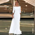 Elegant white off-shoulder mermaid wedding dress with lace bodice details and long sleeves - US 26W / White