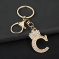 Detailed view of golden zinc alloy letter C keychain with crown and sparkling rhinestones - Letter C Decoration (YJ—310) / Gold