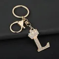 Detailed close-up of sparkling rhinestone letter L keychain with golden crown - Letter L Decoration (YJ—310) / Gold