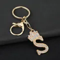 Close-up of golden zinc alloy keychain with rhinestone letter S and crown charm - Letter S Decoration (YJ—310) / Gold
