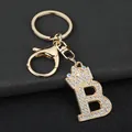 Close-up of a sparkling gold-plated crown letter B keychain with rhinestones - Letter B Decoration (YJ—310) / Gold