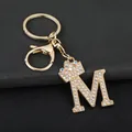 Detailed view of gold rhinestone letter M keychain with a sparkling crown charm - Letter M Decoration (YJ—310) / Gold