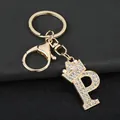 Detailed shot of gold-toned zinc alloy keychain with rhinestone letter P and crown - Letter P Decoration (YJ—310) / Gold