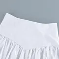 Detail view of a white cotton high-waisted skirt with elegant pleated waistline - S / White