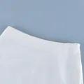 Close-up detail of the waistband and hidden side zipper on a white high-waist sheer skirt - S / Bottoms / White