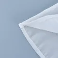 Macro view of the high-quality hem stitching on a white sheer high-waisted skirt - S / Bottoms / White