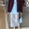 Elegant light blue high waist midi skirt featuring stylish sheer transparent paneling - S / Bottoms / Blue